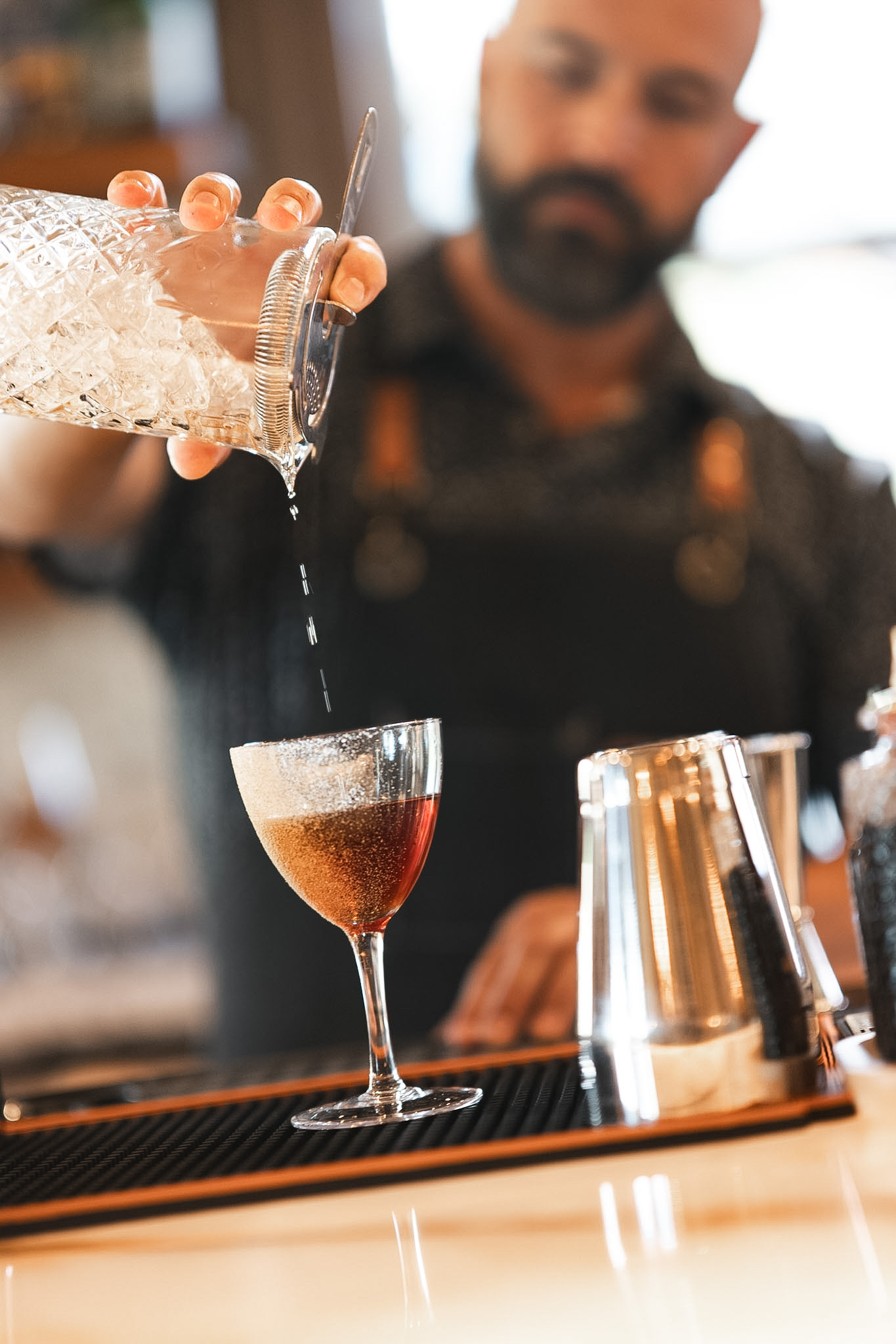Bartender preparing a signature cocktail during a brand session